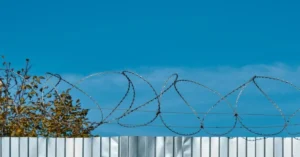 Concertina fencing wire, often referred to simply as "concertina wire," is a type of barbed or razor wire formed in large coils that can be expanded like a concertina (hence the name).