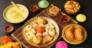 Chandrakala Mithai is a traditional North Indian sweet, typically made during festivals like Holi and Diwali. It consists of a semi-circular dumpling made of all-purpose flour (maida), filled with a sweet mixture of khoya (thickened milk solids), grated coconut, dry fruits, and sugar, sealed like a pastry, deep-fried until golden, and finally dipped in sugar syrup.